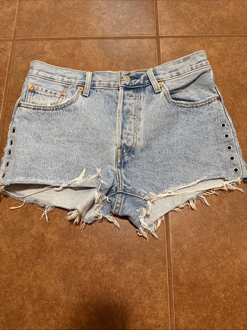 Levi's Light Blue Distressed Denim Cutoff Shorts with Eyelets